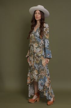 Brand: Promesa Long sleeve button front floral maxi dress with a high low hem. ♡ Details Color: Smoke Green Working button front High low hem Partially lined 100% Rayon Hand wash recommended Size & Fit Model Info: Height 5'3"| Bust 32"| Waist 25"| Hips 34" Model is wearing a size small Fit: Relaxed fit Stretch: No stretch Measurements: S: Bust 35" | Length 54" M: Bust 37" | Length 55" L: Bust 39" | Length 55" Spring Garden Party Dress With High-low Hem, Bohemian Fitted Midi Dress With High-low Hem, Spring Maxi Dress With Asymmetrical Hem For Garden Party, Bohemian Floral Print Dress With High-low Hem, Green Bohemian Button-up Dress, Bohemian Dress With Floral Print And High-low Hem, Fall Vacation Floral Print Maxi Dress, Fall Floral Print Maxi Dress For Daywear, Buttoned Maxi Dress For Garden Party