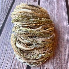 a ball of yarn sitting on top of a wooden table