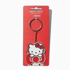 a hello kitty keychain is shown on a red card with the word hello kitty