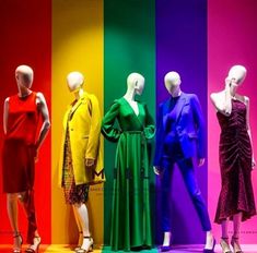 a group of mannequins dressed in different colored outfits