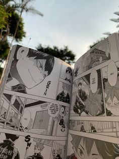 an open comic book with pictures of people and trees in the backgroung