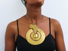 African Brass necklace, Brass jewelry, African jewelry for women, Tribal necklace, One size fits all, Christmas Gift for her, Moms gift The necklace is handcrafted using brass metal. Length: 9 inches Shipping fee is for the first item only, additional items ship for FREE. DHL Express shipping with 3-5 days delivery. To view our brass collection, click here: https://www.etsy.com/shop/NkoroiCrafts?ref=simple-shop-header-name&listing_id=1295061994&section_id=39639351 *Care instructions* Brass tarnishes with exposure to moisture and oxidation. To clean it, kindly use a lemon wedge. Squeeze the juice and polish along the surface with a clean cloth. Costume Jewelry Brass Necklace With Round Pendant, Brass Round Pendant Necklace In Costume Jewelry Style, Brass Round Pendant Necklace Costume Jewelry, Costume Jewelry Choker Necklaces For Gifts, Unique Brass Choker Jewelry, Choker With Large Pendant, Costume Jewelry Round Choker, Adjustable Pendant Necklace With Unique Design, Costume Jewelry Round Choker As Gift