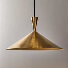 a gold colored pendant light hanging from a ceiling