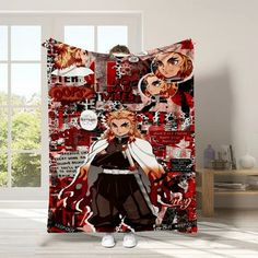 an anime character shower curtain with red and black art on the wall in front of a window