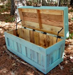 an old wooden box is sitting in the woods