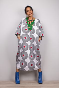 "Ankara dress, African print dress, Black and white dress, Midi dress, Cotton dress, Loose fit kaftan dress PRODUCT SIZE : One Size Fits Most ( up to US 18) These are the exact measurements from the dress, measured whilst laying flat >> * Chest : up to 44\" * Waist : up to 44\" * Hips : up to 48\" * Sleeve length : 19\" * Length : 46\" NOTE : * Model chest : 32\", waist : 24\" hips : 35\" * Combined Height is 5\"6 > I'm 5\"2 (158cm) and I'm wearing 4\" heels in the pictures MATERIAL * Cotton, Ho Red Ankara Fabric Short Sleeve Dress, White Oversized Printed Dress, Ankara Fabric Maxi Dress With Print, Spring Ankara Maxi Dress, Spring Maxi Dress In Ankara Fabric, Ankara Fabric Beach Dress For Summer, Summer Maxi Dress In Ankara Fabric With Short Sleeves, Summer Beach Dress In Ankara Fabric, Red Ankara Maxi Dress