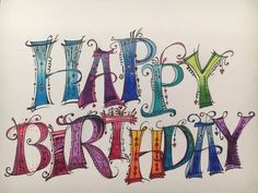 the words happy birthday are drawn in colored ink on white paper with black marker pens