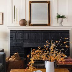 black painted brick fireplace Painting A Brick Fireplace Black, Antique Brick Fireplace Surround, Brown Painted Fireplace Brick, Remove Paint From Brick Fireplace, Chalk Paint Fireplace Brick, Brick Fireplace Decor, Black Brick Fireplace, Red Brick Fireplaces