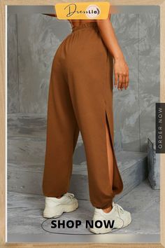 Solid Pocket Elastic Waist Cut Out Side Casual Sweatpants Casual Solid Bottoms With Side Slits, Casual Pants With Side Slits And Stretch, Casual Stretch Pants With Side Slits, Casual Bottoms With Side Slits, Casual High Waist Pants With Side Slits, Casual Loungewear Bottoms With Side Slits, Casual Lounge Bottoms With Side Slits, Casual Trousers With Side Slits, High Waist Solid Bottoms With Side Slits