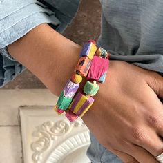 Pairs of rectangular Kantha beads are interspersed with a round Kantha bead for a colorful mix of shapes and textures. Colors and patterns will vary due to repurposed textiles. Sustainably handmade by women artisans in India. Women Artisans, Colors And Patterns, Textiles, India, Texture, Bracelet, Beads, Pattern, Color