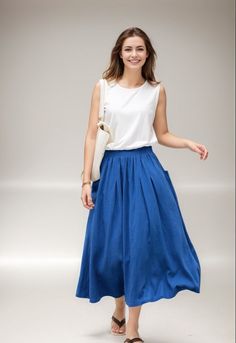 Upgrade your wardrobe with our Midi Linen Skirt, an ideal choice for a laid-back day out. This A-line skirt, with its elastic waist and pleated design, is not just stylish but also offers optimum comfort. ★★FEATURES 50% linen, 50% Cotton No lining Two side pockets Elastic Waist Skirt A-line skirt Pleated skirt Regular fit skirt Perfect for Summer, Spring, Autumn ★★ Bespoke Order Service If you Request other color Request the length Your height is not between 155 cm- 172 cm Your weight is over 75 kg I can do it for you, It will need some extra fee depending on on your need. Contact with me for more detail. ★★ Get your size in Size Chart with your body measurement https://www.etsy.com/listing/794055682 ★★ Warmly Note: 1 ) : Please confirm your shipping address! If you wish to ship the item t Casual A-line Voluminous Skirt, Casual Blue A-line Skirt, Blue Relaxed Pleated Skirt With Elastic Waistband, Flowy A-line Maxi Skirt With Pockets, Blue Pleated Skirt With Elastic Waistband, Blue A-line Bottoms With Pockets, Summer A-line Maxi Skirt With Pockets, Blue Midi Skirt With Pockets, Relaxed A-line Pleated Skirt With Pockets