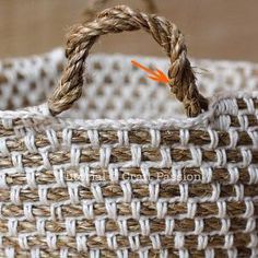 a close up of a woven basket with an orange arrow pointing to the top and bottom