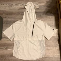 - Brand New - Never Worn Before - No Stains, Rips, Or Any Other Imperfections - Perfect Condition - White And Grey - Logo And All Tags Still In Perfect Condition - Zipper Works Super Smooth - Bottom Half Is Mesh - Top Half Is A Raincoat Material - Rare - No Longer Sold - Retailed For $100 - I Think Price Is Reasonable But Feel Free To Send Offers Or Trades! White Cotton Outerwear For Outdoor Activities, White Sporty Tops With Pockets, White Casual Outerwear For Outdoor Activities, Casual White Outerwear For Outdoor Activities, White Sports Tops With Pockets, Urban White Hooded Outerwear, White Casual Windbreaker For Outdoor Activities, White Windbreaker With Pockets For Outdoor Activities, Casual White Hooded Windbreaker