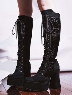 Step into a world of elegance and style with our Black Suede Floral Boots. Crafted from premium black suede, these boots are adorned with intricate floral patterns that add a touch of femininity and sophistication. The front lace-up design not only enhances the aesthetic appeal but also allows for a customizable fit. For added convenience, a zipper on the side ensures easy wear and removal. The boots boast a thick platform and a chunky high heel, providing both height and stability, making them perfect for any occasion. Whether you're dressing up for a night out or adding a statement piece to your everyday look, these boots are sure to turn heads. The price includes one pair of boots, making them a must-have addition to your footwear collection.   	 		 			Size 			35 			36 			37 			38 			39 Gothic Knee-high Platform Boots For Party, Gothic Platform Lace-up Boots, Gothic Black Lace-up Heeled Boots, Gothic Black Lace-up Boots With Chunky Platform, Gothic High Heel Platform Lace-up Boots, Floral Boots, Gothic Shoes, Steampunk Fashion Male, Gothic Skirts