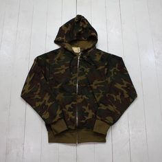 1970s Sears Fieldmaster Thermal Line Zip Up Camo Hoodie Sweatshirt Made in USA Size XS/S condition - good - loose stitching on pocket/light distressing - long sleeves tagged S - fits XS/S approx - please consult measurements  17.5" pit to pit  23.5" length  23.75" sleeve length  Please contact us if you have more questions about this garment. Retro Hooded Jacket For Fall Streetwear, Vintage Khaki Tops For Winter, Vintage Hooded Top For Fall, Retro Hoodie With Drawstring Hood For Fall, Casual Camouflage Cotton Hooded Jacket, Vintage Hoodie With Drawstring For Fall, Vintage Hoodie For Streetwear In Fall, Camouflage Cotton Sweatshirt For Winter, Vintage Cotton Hooded Jacket For Fall