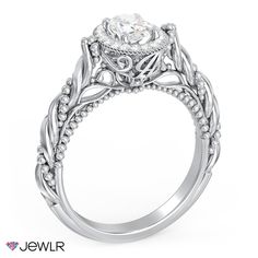 a white gold engagement ring with an intricate design