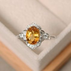 Citrine ring sterling silver finished with rhodium by LuoJewelry Citrine And Diamond Ring, Oval Citrine Birthstone Ring With Center Stone, Oval Citrine Birthstone Ring For Anniversary, Oval Yellow Topaz Promise Ring, Yellow Oval Topaz Promise Ring, Yellow Oval Crystal Ring For Wedding, Oval Citrine Crystal Promise Ring, Oval Citrine Birthstone Ring, Oval Yellow Citrine Birthstone Ring