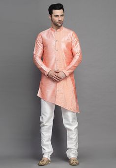 Art Silk Kurta in Peach. This Readymade attire is Enhanced with Buttons. Crafted in Chinese Collar Neck and Full Sleeve. Available with an Art Silk Churidar in Off White. Do note: Footwear shown in the image is for presentation purposes only. Half to one inch may vary in measurement. (Slight variation in actual color vs. image is possible). We sell all kinds of menswear. Mens Kurta | Mens Kurta Pajama | Mens Sherwani | Mens Sherwani Sets | Traditional Menswear | Partywear Menswear | Indian Mens Fitted Orange Kurta For Summer, Festive Peach Sets For Spring, Orange Long Sleeve Kurta For Spring, Peach Long Sleeve Sets For Spring, Spring Wedding Peach Kurta, Long Sleeve Peach Kurta For Festive Occasions, Peach Long Sleeve Kurta For Festive Occasion, Spring Festive Orange Kurta, Menswear Indian