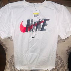 Nike T-Shirt Men’s Size Small Brand New Tags Attached Red Swoosh Black Nike Nike Text Print Top For Streetwear, Nike Tshirt Men, Nike Tops With Text Print For Streetwear, Nike Graphic Tee With Crew Neck, Nike Streetwear Top With Text Print, Nike Casual T-shirt With Letter Print, Nike Graphic Tee Shirt, Nike Graphic Tee For Streetwear, Nike Graphic Tee Shirt With Graphic Print