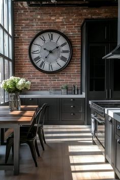 a large clock mounted to the side of a brick wall above a kitchen table with chairs