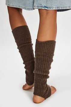 Sure to be the coolest addition to your accessories collection, these totally timeless legwarmers are featured in a sleek, ribbed knit fabrication and toe-less, heel-less style for the perfect wear-anywhere style. | Ribbed Stirrup Legwarmers by Hansel From Basel at Free People in Brown Trendy Fitted Solid Leg Warmers, Trendy Fitted Solid Color Leg Warmers, Trendy Ribbed Thigh-high Leg Warmers, Solid Footless Leg Warmers For Fall, Trendy Ribbed Thigh High Leg Warmers, Trendy Thigh High Ribbed Leg Warmers, Fitted Knit Footless Leg Warmers, Solid Ribbed Stretch Leg Warmers, Solid Stretch Ribbed Leg Warmers