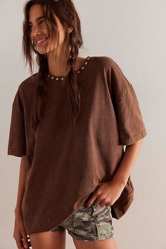 Effortlessly cool and so essential, this laidback tee is featured in a soft cotton fabrication and oversized fit with bold embroidery and a classic crew-neckline. **Fit:** Relaxed, oversized fit **Features:** Soft cotton fabrication, crew-neckline, drop-shoulder sleeves, embroidered graphic at back, star detail at neckline **Why We ❤ It:** This embroidered top is a unique addition to any collection of cool tees. | Frontier Embroidered Tee by Denim and Bone at Free People in Brown, Size: XL Oversized T-shirt With Frayed Hem For Spring, Brown Relaxed Fit Top, Oversized T-shirt For Summer Casual Gatherings, Oversized Brown T-shirt, Relaxed Cotton Tops With Frayed Hem, Oversized T-shirt For Casual Gatherings, Relaxed Fit Cotton T-shirt With Frayed Hem For Spring, Relaxed Washed T-shirt, Relaxed Crew Neck Top With Frayed Hem