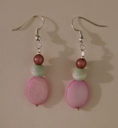 "\"EASTER BASKET\" earrings The Easter bunny brought these earrings, featuring vintage round pink beads, round green glass beads, flat oval pink shell beads, and silver seed beads. Approximate Measurements: Earring Length - 2.25 inches Earring Drop Length - 1.5 inches Earring Width - .5 inch *These earrings arrive in a handmade, hand-decorated box." Pink Round Beaded Earrings With Dangling Beads, Pink Round Beads Earrings Nickel Free, Pink Nickel-free Round Beaded Earrings, Pink Nickel-free Round Bead Earrings, Nickel Free Pink Round Bead Earrings, Pink Hypoallergenic Beaded Earrings With Round Beads, Pink Round Beaded Earrings, Handmade Pink Pearl Earrings, Pink Round Earrings For Jewelry Making