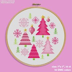 a cross stitch christmas tree pattern on a pink background