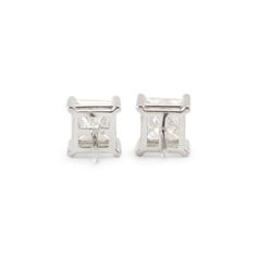 Metal Type: 14K White Gold  Width: 6.65 mm  Weight:1.79 grams  14K White Gold diamond stud earrings with push backs. The metal was tested and determined to be 14K white gold. Engraved with "14K". In excellent condition.  Pre-owned. Might show minor signs of wear.  4-Prong Set in 14 Karat White Gold with:  Two (2) princess cut natural diamonds:  Measurements: 5.18mm x 5.48mm x ~3.84mm in depth. Weight Range: 0.858 ct. - 0.915 ct. Total Carat Weight: 2.20 ct. Color: L - M Clarity: I2 Polish: Very Good Symmetry: Very Good  TOTAL WEIGHTS:  Total weight of diamond(s): 2.20 ctw. White Gold Baguette Cut Earrings With Prong Setting, Silver Baguette Cut Earrings With Prong Setting, Silver Earrings With Baguette Cut In Prong Setting, Silver Baguette Cut Diamond Earrings With Prong Setting, Classic Asscher Cut White Gold Earrings, White Baguette Cut Diamond Earrings With Prong Setting, Formal White Earrings With Channel Set, Gia Certified Silver Baguette Cut Diamond Earrings, Classic White Channel Set Earrings