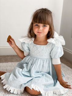 Spring First Communion Dress With Bow, Spring Blue Princess Dress With Bow, Summer Blue Princess Dress With Bow, Blue Princess Dress With Bow For Summer, Light Blue Princess Dress With Bow, Charlotte Baby, Blue Linen Dress, Boutique Baby, Children's Boutique