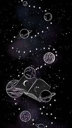 an open book sitting on top of a table in the middle of space with stars and planets