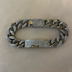 Gifted But Never Worn Lv Chain Bracelet. Mens Or Womens. See Serial Number For Additional Details. Luxury White Gold Bracelets With Silver-tone Logo, Designer Silver Chain Bracelets, Luxury Engraved White Gold Chain Bracelet, Luxury Engraved Chain Bracelet For Formal Occasions, Lv Bracelet, Louis Vuitton Chain, Monogrammed Cuff, Mens Chain Bracelet, Louis Vuitton Jewelry