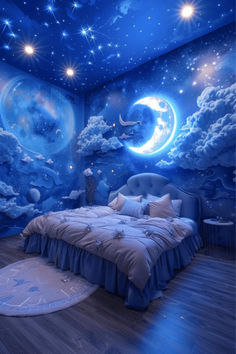 a bedroom decorated in blue with stars and clouds