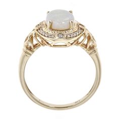 Give her this unique, regal jewelry from Gin & Grace. A colorful display and chic design showcases Natural opal gems and glistening diamonds. The pretty ring is gleaming and made of 14k yellow gold. Gemstone colors: White Gemstone shapes: Oval-cut One prong-set Oval-cut Australian Opal Gemstone weight: 1 5/6 carats Total gemstone weight: 1 1/20 carats Diamonds: 24 Diamond cut: Round Diamond weight: 1/9 carat Color: G-H Clarity: I1-I2 Setting: Prong Metal: 14K Yellow Gold Finish: High polish Elegant Multi-stone Opal Jewelry, Fine Jewelry Opal Ring With Diamond And Gemstone Accents, Elegant Gold Opal Ring, Elegant White Gold Opal Ring, Formal Fine Jewelry Moonstone Ring With Gemstone Accents, Luxury Yellow Gold Opal Ring With Accent Stones, Luxury Diamond Opal Ring With Gemstone Accents, Luxury Opal Ring With Diamond And Gemstone Accents, Elegant White Gemstone Birthstone Ring