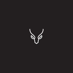 an animal's head is shown in the middle of this minimalistic black and white logo