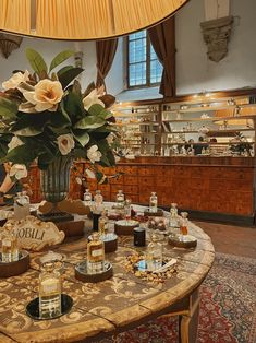 a table topped with lots of bottles and flowers