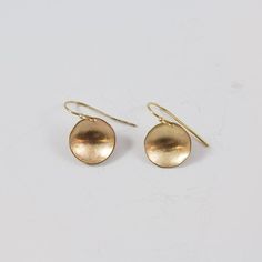 Match these with just about any outfit in your closet. One of our best sellers and one of the new jewelry staples of your wardrobe.  http://www.clpjewelry.com/new/concave-small-earrings  .  .  .  #clpjewelry #handmadejewelry #gold #earrings #goldearrings #jewelry #denverjewelry #303style #dangles #shop303 #shopdenver Yellow Gold Circle Brass Earrings, Yellow Gold Circle Earrings In Brass, Hammered Yellow Gold Circular Earrings, Yellow Gold Hammered Circle Earrings, Yellow Gold Jewelry With French Hook, Nickel Free Circle Bronze Jewelry, Adjustable Brass Round Disc Jewelry, Nickel-free Bronze Circular Jewelry, Adjustable Hammered 14k Gold Earrings