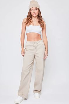 Comfy meets chic! Our Wide Leg Jogger is perfect for the days you want to wear sweatpants, but want to look a little more elevated. These come in a cotton-blend fabric with a high-waist, elasticized waistband, and wide legs. This pant also features two front pockets. These wide-leg joggers are the perfect addition to y Wide Leg Sweatpants With Elastic Waistband For Casual Wear, Chic Cotton Wide Leg Pants For Smart Casual Occasions, Chic Cotton Wide Leg Pants For Elevated Casual Wear, Chic Wide Leg Cotton Pants For Elevated Casual, Cotton Relaxed Wide Leg Pants For Everyday, Relaxed Cotton Wide Leg Pants For Everyday, Everyday Cotton Relaxed Wide Leg Pants, Everyday Relaxed Cotton Wide Leg Pants, Trendy Cotton Wide Leg Pants With Elastic Waistband