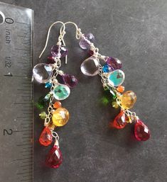 "I created these colorful dangles to celebrate being a jewelry designer for 12 years! Thank you to all of my wonderful customers for the support! These are made in sterling silver wire with amethyst, citrine, quartz, fire moonstone and more! The apprx. length is 2.5\" . Sterling silver wiring and French Ball earwires. Your earrings will be beautifully gift boxed. (To see VIDEO of these earrings please visit my instagram, @Sueanneshirzay August 12 2020 )" Colorful Drop Earrings As A Gift, Nickel-free Multicolor Earrings For Birthday, Multicolor Nickel-free Crystal Earrings For Gift, Handmade Colorful Jewelry For Birthday, Rainbow Crystal Drop Earrings For Gift, Multicolor Sterling Silver Party Earrings, Multicolor Sterling Silver Earrings For Party, Party Multicolor Sterling Silver Earrings, Whimsical Rainbow Dangle Jewelry