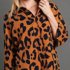 Liza's Umgee Blouse Top w/ Navy Animal Print  Ochre Background  You will love this classy Animal Print Button up blouse! Dark Navy Blue with Ochre Background  Pair it with our Navy Layering Dress HERE  Bust Sizes: Small: 36" Medium: 38"-40" Large: 40"-42" Extra Large: 42"-44" 1X: 44"-46" 2X: 46"-48" Actual colors may vary slightly due to differences in lighting and monitors. Leopard Print Long Sleeve Top With Buttons, Long Sleeve Leopard Print Top With Buttons, Leopard Print Button-up Top, Leopard Print Button-up Top With Buttons, Fall Leopard Print Tops With Buttons, Fall Leopard Print Button-up Blouse, Leopard Print Button-up Top For Work, Blouse Price, Layer Dress