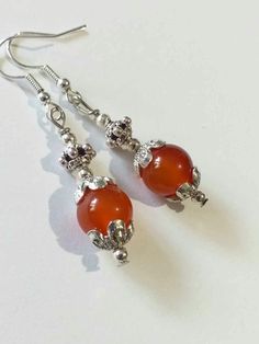 Carnelian Victorian Silver earrings Boho Earrings Silver Carnelian earrings orange-red jewelry Carnelian earring Carnelian jewelry gift set Carnelian Victorian earrings Bohemian earrings . Beautiful Set of silver-tone ornament beads and Genuine Carnelian necklace and earrings. Silver-tone Victorian style necklace and earrings. Boho necklace. Bohemian necklace and earrings. Romantic necklace and earrings. Beautiful necklace with same style earrings with Genuine Carnelian.  Perfect Gift for girlfriend,  mother,  sister,  bridesmaids or Maid of honor. Gift for special people or jewelry set for your special occasion. You may choose from the options menu from: earrings,  jewelry set earrings and necklace,  and jewelry set earrings and necklace + same style bracelet. FREE SHIPPING   Material: si Carnelian Earrings, Victorian Earrings, Romantic Necklace, Perfect Gift For Girlfriend, Carnelian Jewelry, Carnelian Necklace, Red Jewelry, Earrings Bohemian, Bohemian Necklace