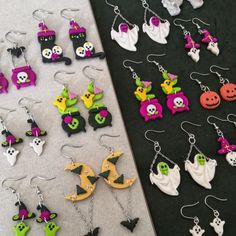 several halloween themed items are displayed on the table next to each other, including earrings and necklaces