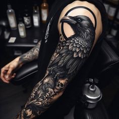 a man with a black crow tattoo on his arm