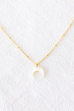 Mahina Necklace – Laine Honolulu Minimalist White Necklace With Satellite Chain, Minimalist White Necklaces With Satellite Chain, White Dainty Pearl Necklace With Satellite Chain, White Dainty Jewelry With Moon Charm, White Sterling Silver Necklace With Satellite Chain, Dainty White Pearl Necklace With Satellite Chain, Delicate White Pearl Necklace With Satellite Chain, Dainty White Moon-shaped Jewelry, Dainty Crescent Jewelry With Delicate Chain