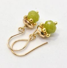 Gold Jade Jewelry With Faceted Beads, Gold Hypoallergenic Jade Earrings, Hypoallergenic Gold Jade Earrings, Elegant Green Earrings With Faceted Beads, Peridot Dangle Earrings In Gold, Elegant Green Earrings With Gold Beads, Gold Peridot Earrings For May Birthstone, Hematite Earrings, Unique Earrings