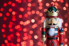 a nutcracker is standing in front of some lights