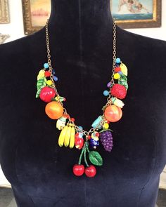 "This is a wonderful necklace hand-made by Lori Gutierrez! Lori created a tropical paradise on a necklace - hand-painted exotic fruits, interspersed with cute little toucan birds!   A uniquely colorful, fun and charming one-of-a-kind work of jewelry art!   The chain is adjustable length 20\" - 25\".   Thanks for looking!!" Playful Hand Painted Multicolor Jewelry, Adjustable Fun Fruit Design Jewelry, Handmade Multicolor Tropical Jewelry, Handmade Tropical Multicolor Jewelry, Handmade Multicolor Necklace Souvenir, Tropical Style Multicolor Jewelry As Gift, Whimsical Multicolor Hand Painted Jewelry, Unique Hand Painted Colorful Jewelry, Unique Colorful Hand Painted Jewelry