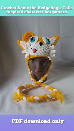 a crochet hat with a cat on it and the words crochet sonic the hedgehog's tails inspired character hat pattern