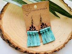 Get your free-spirit boho vibe on with these fun handmade macrame earrings!  These bohemian earrings were carefully hand knotted using soft recycled cotton cord on a wood piece. These dangle earrings are very lightweight. Makes the perfect gift for the hippie girl in your life.  Handmade with love in the USA.  *Nickel free earrings. Handmade with eco-friendly materials! I use high quality cord made from recycled cotton. Nearly all my products are made with recycled cotton or recycled polypropylene cord. I strive to be as eco-friendly as possible with all my materials and processes. ** Attention local buyers ** If you prefer to arrange for in-person pick up instead of having your item shipped to you, please message me after placing your order and I can refund any shipping costs where applic Handmade Adjustable Bohemian Tassel Earrings, Bohemian Adjustable Tassel Earrings With Fringe, Bohemian Adjustable Tassel Dangle Earrings, Adjustable Bohemian Tassel Earrings With Fringe, Handmade Adjustable Tassel Earrings For Festival, Bohemian Macrame Tassel Dangle Earrings, Bohemian Adjustable Macrame Tassel Earrings, Bohemian Macrame Tassel Earrings, Bohemian Jewelry Earrings