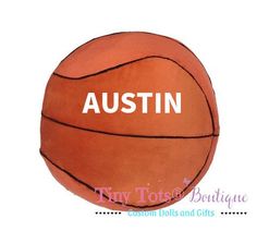 an orange basketball ball with the word, austin in white on it's side